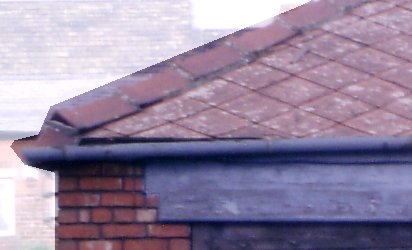 Photo taken in 1987 showing asbestos squares laid 'diamond pattern' on a small indistrial building roof