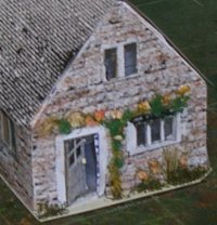 Photo showing roses and flowers on cottage front