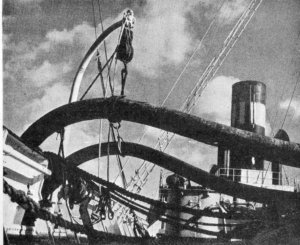 Photo of oil hoses being used to bunker a ship in the 1930s