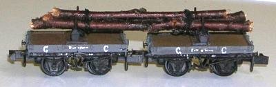 photo of model tree trunks on bolster wagons