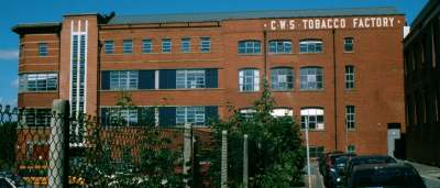 Photo of a building with off-set lettering in the brickwork