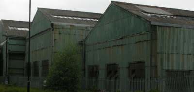 Photo of an example of frame construction showing corrugated iron walls, corrugated asbestos cement roofing