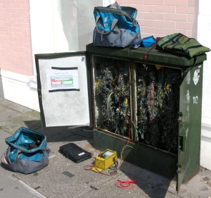 Telephone junction box being worked on