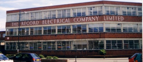 Photo of a building with elaborate lettering in the brickwork